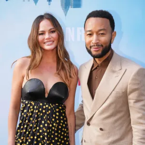 John Legend Says Chrissy Teigen Injured Neck Trying to Be an Acrobat