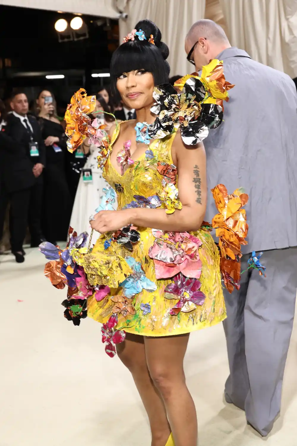 Nicki Minaj Puts On a Quirky Display in Canary Yellow Floral Appliqu&eacute; Dress at the 2024 Met Gala