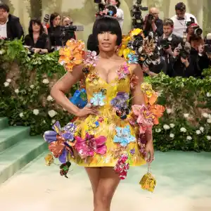 Nicki Minaj Puts On a Quirky Display in Canary Yellow Floral Appliqué Dress at the 2024 Met Gala