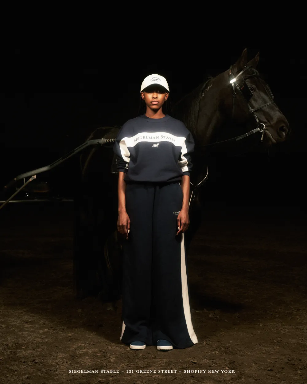 Woman in Siegelman Stables tracksuit with hourse