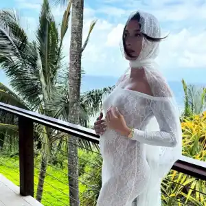 Pregnant Hailey Bieber Cradles Baby Bump in New Photo From Stunning Maternity Shoot