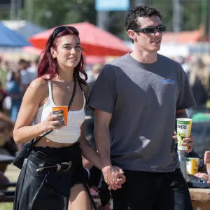 Dua Lipa and Callum Turner Sweetly Hold Hands During Date at UKs Glastonbury Festival
