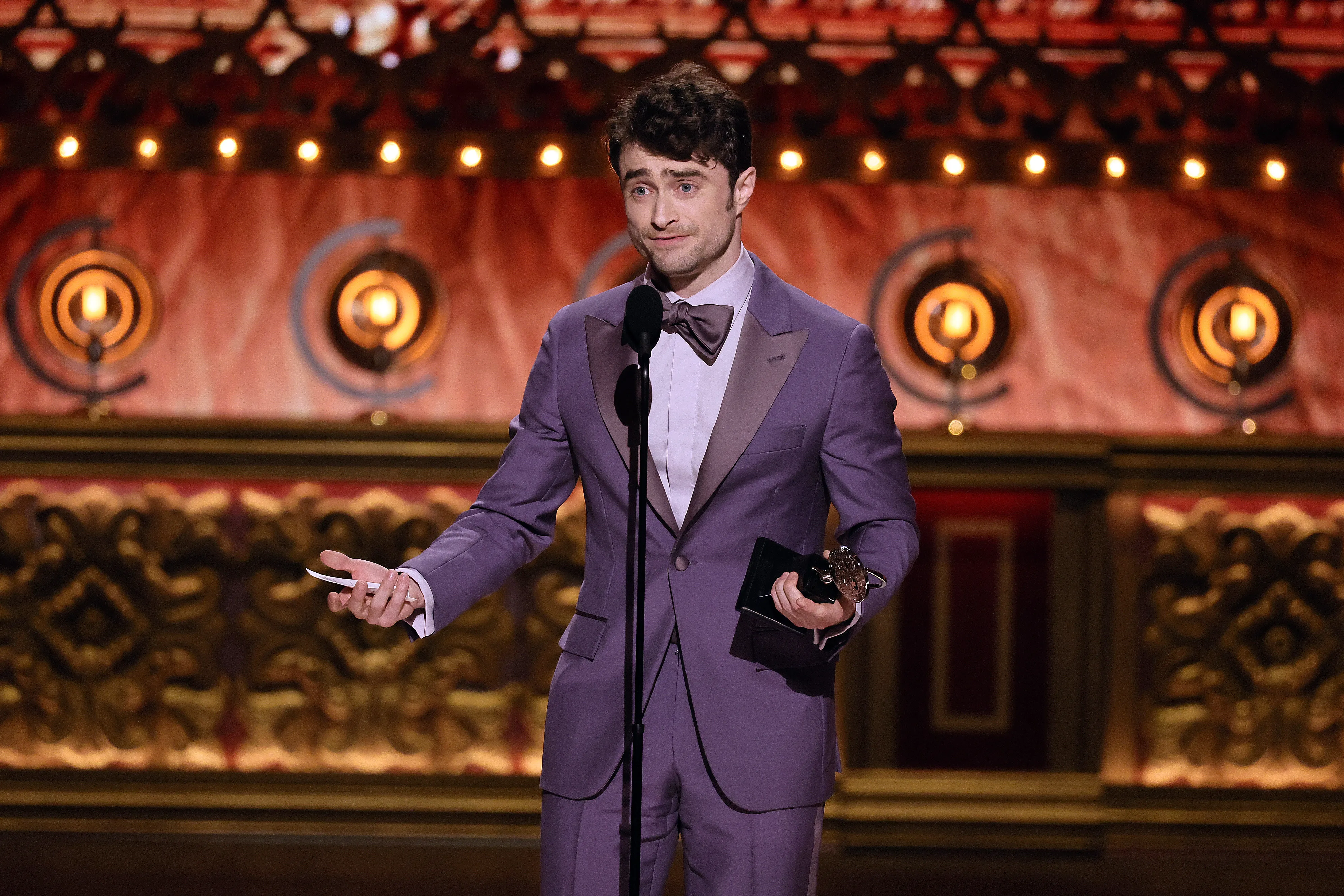 NEW YORK, NEW YORK - JUNE 16: Daniel Radcliffe accepts the Best Performance by an Actor in a Featured Role in a Musical award for "Merrily We Roll Along" onstage during The 77th Annual Tony Awards at David H. Koch Theater at Lincoln Center on June 16, 2024 in New York City. (Photo by Theo Wargo/Getty Images for Tony Awards Productions)