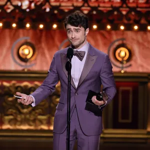 NEW YORK, NEW YORK - JUNE 16: Daniel Radcliffe accepts the Best Performance by an Actor in a Featured Role in a Musical award for "Merrily We Roll Along" onstage during The 77th Annual Tony Awards at David H. Koch Theater at Lincoln Center on June 16, 2024 in New York City. (Photo by Theo Wargo/Getty Images for Tony Awards Productions)