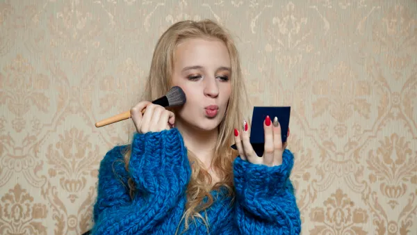 Woman applying makeup