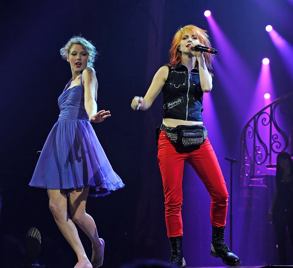 Hayley Williams Wears Purple Dress, Sharpies Lyrics on Arm for &lsquo;Eras&rsquo; Duet as Ode to Taylor Swift