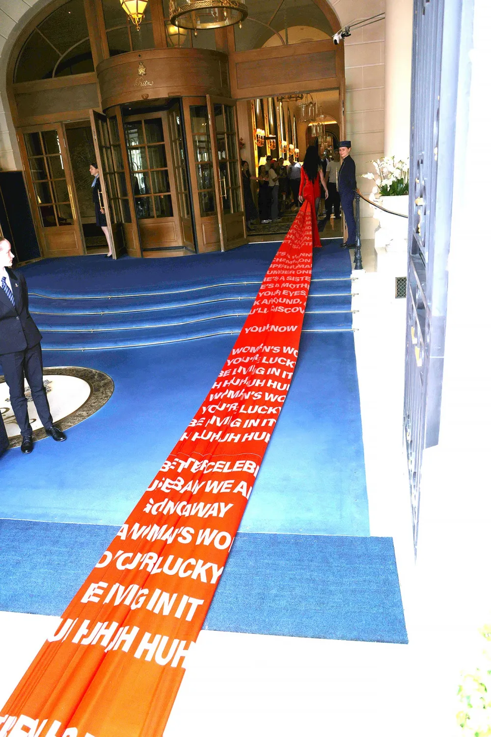 Katy Perry&rsquo;s Paris Fashion Week Dress Has a 200-Foot-Long Train With The Lyrics to &lsquo;Woman&rsquo;s World&rsquo;