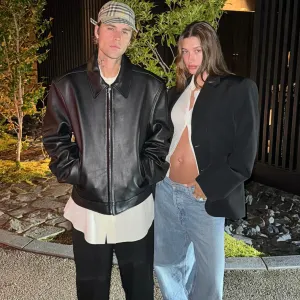 Justin Bieber Kisses Pregnant Wife Hailey While Cradling Her Baby Bump in Romantic Moment