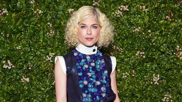 Selma Blair Debuts New Curly Hairstyle With Service Dog Scout in Tow
