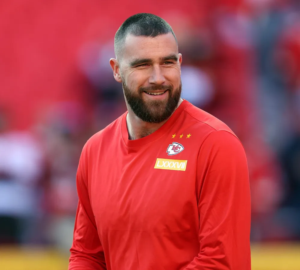 Travis Kelce Reacts to Podcast Hosts Role Playing His Post Softball Game Convo With Taylor Swift