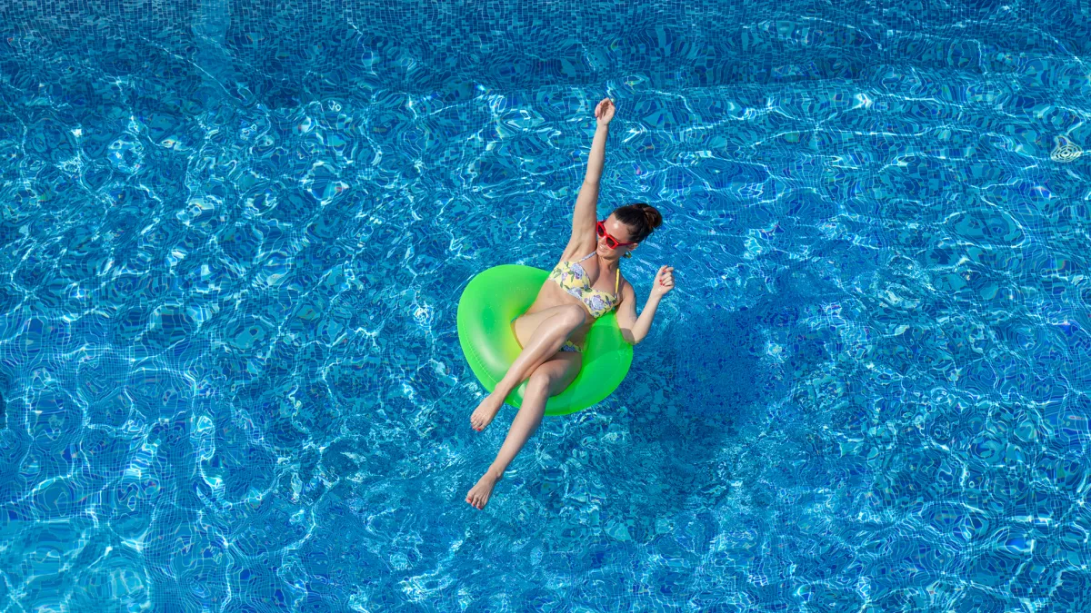 woman have fun in swimming pool