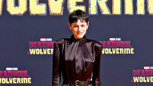 Emma Corrin Puts a Creative Spin on the Pantless Trend With Suspenders and Thigh High Socks