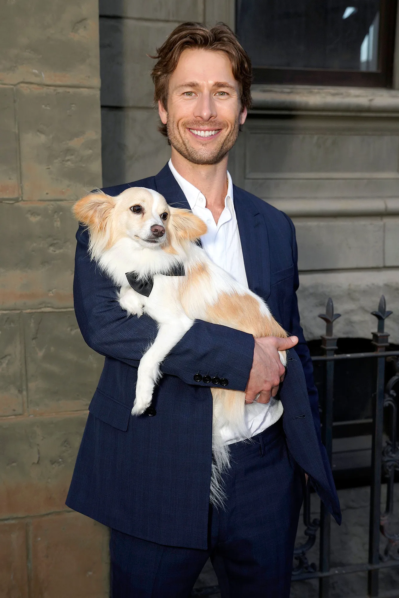 Glen Powell Knows His Internet Famous Dog Brisket Was ‘Meant to Be on a Movie Set’