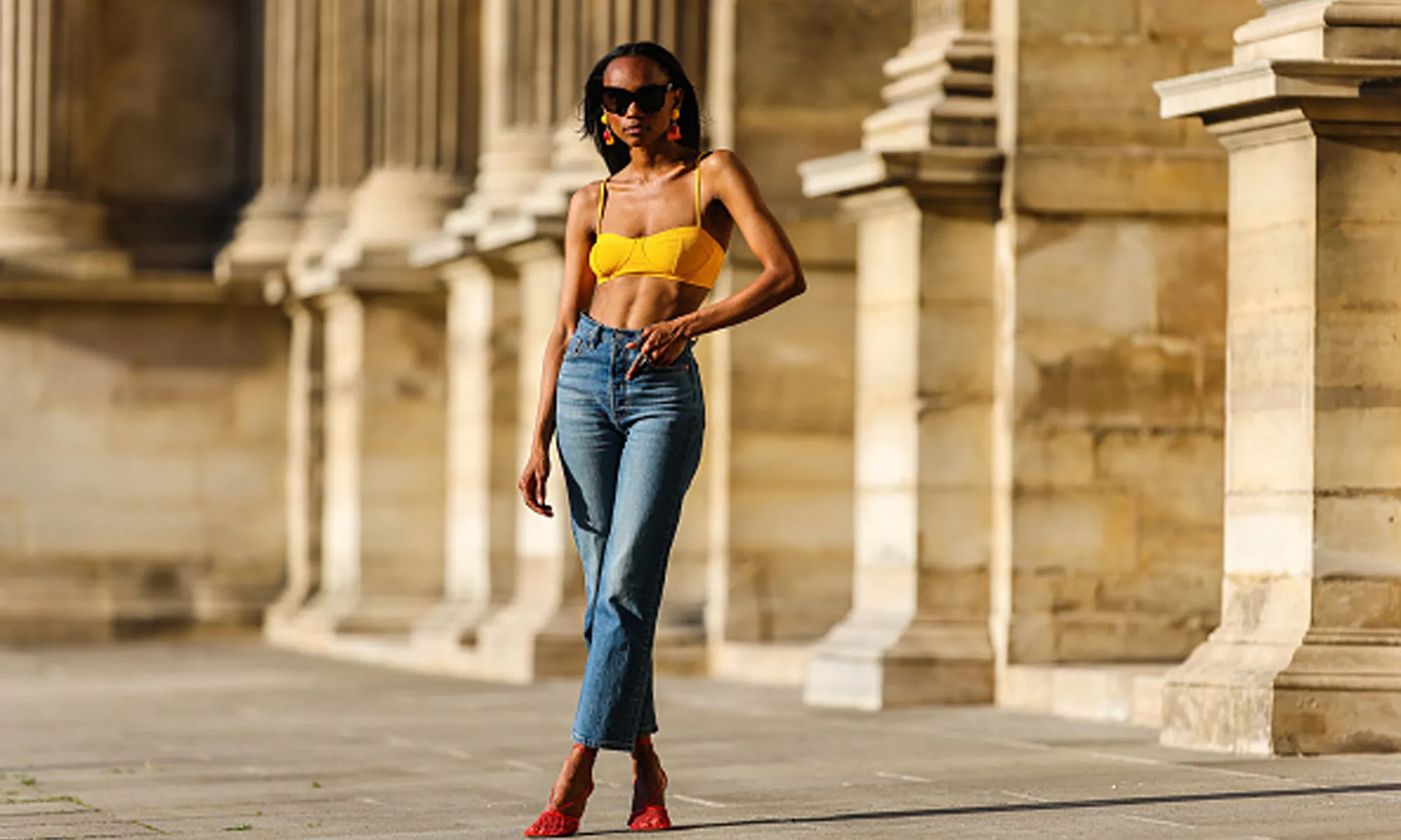woman wearing bralette jeans and heels