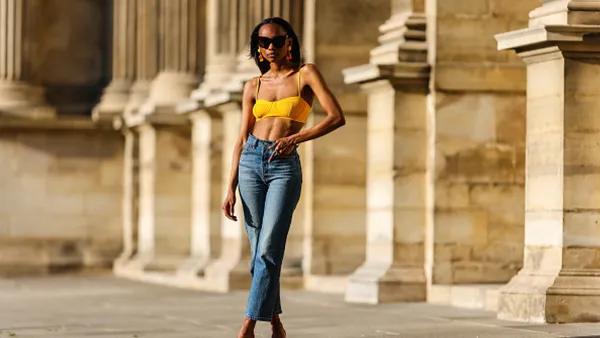 woman wearing bralette jeans and heels