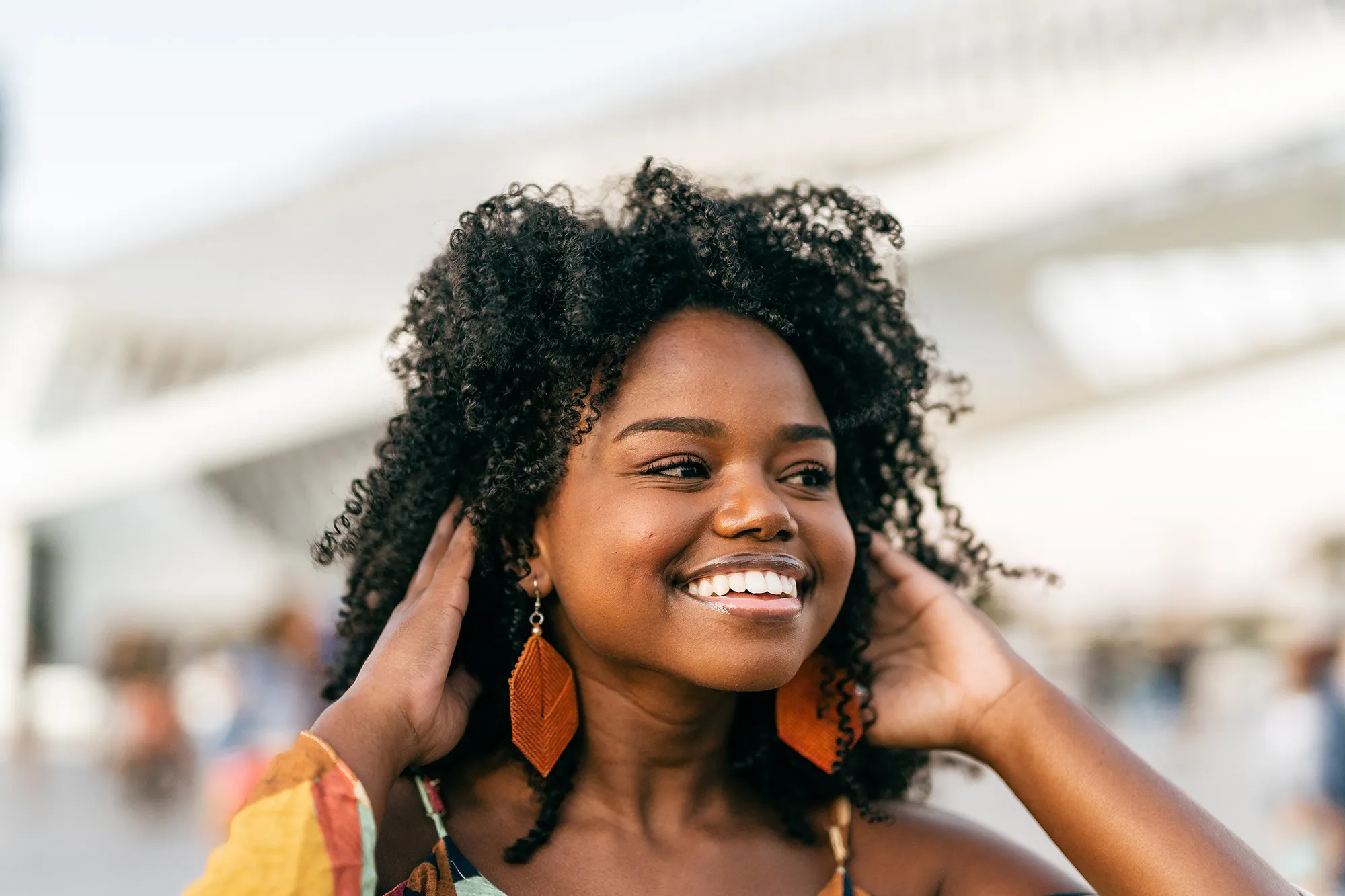 Smiling Black woman in the city