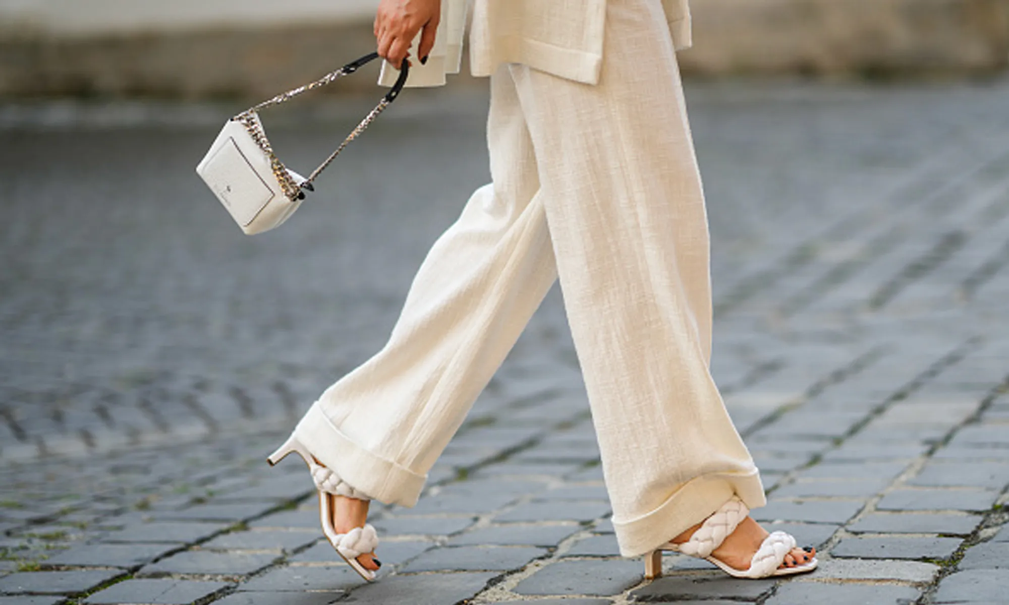 woman wearing flowy beige pants