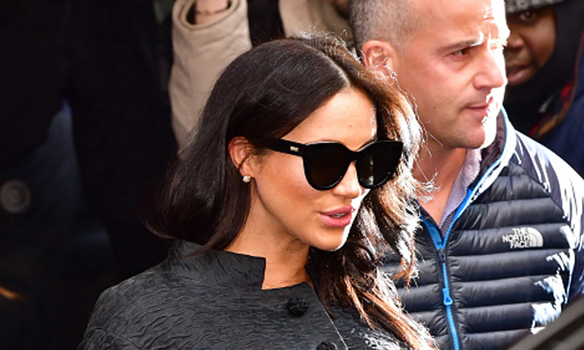 Meghan Markle wearing black sunglasses