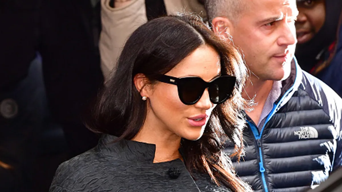 Meghan Markle wearing black sunglasses