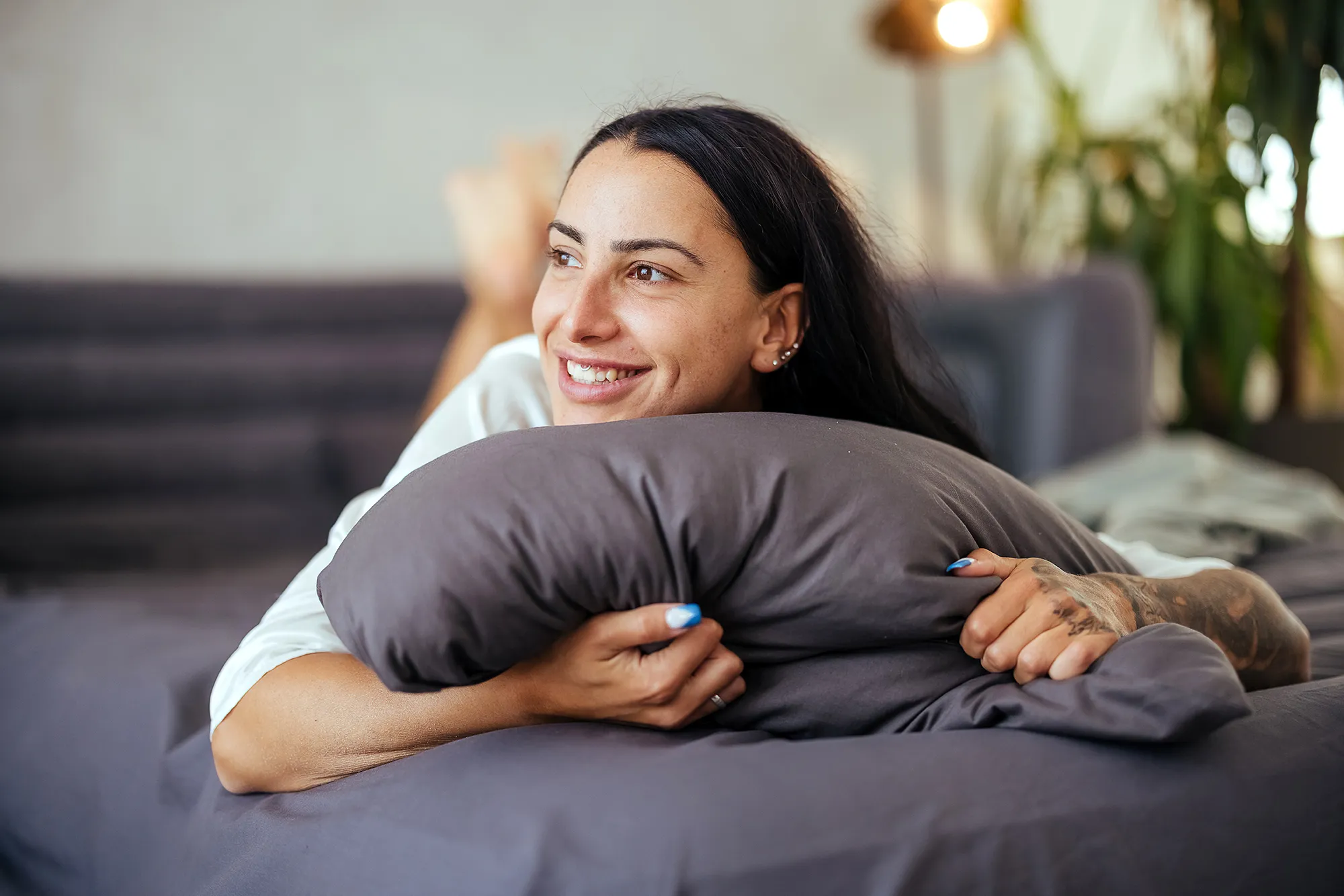 Portrait of a beautiful woman in bed in the morning