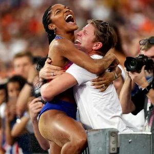 Feature Tara Davis-Woodhall Almost Blacked Out When She Lept Into Husband Hunter Arms After Winning Gold