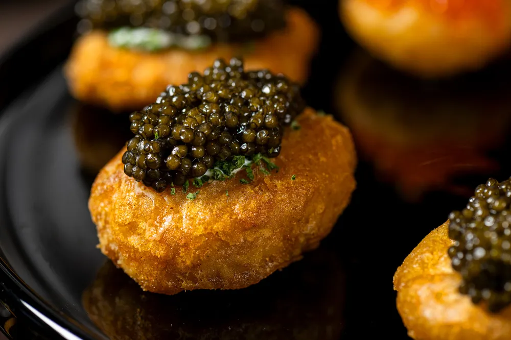 Try Caviar Topped Chicken Nuggets at the US Open 2024 from Michelin Starred Chef Simon Kim