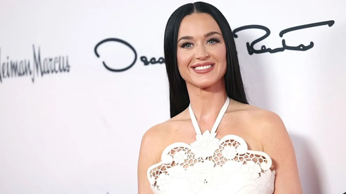 Katy Perry wearing white dress on red carpet