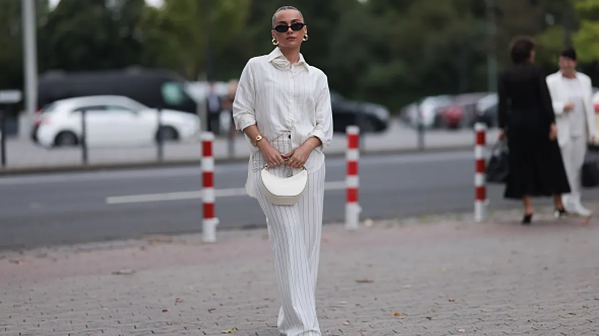 woman wearing striped white matching set on street