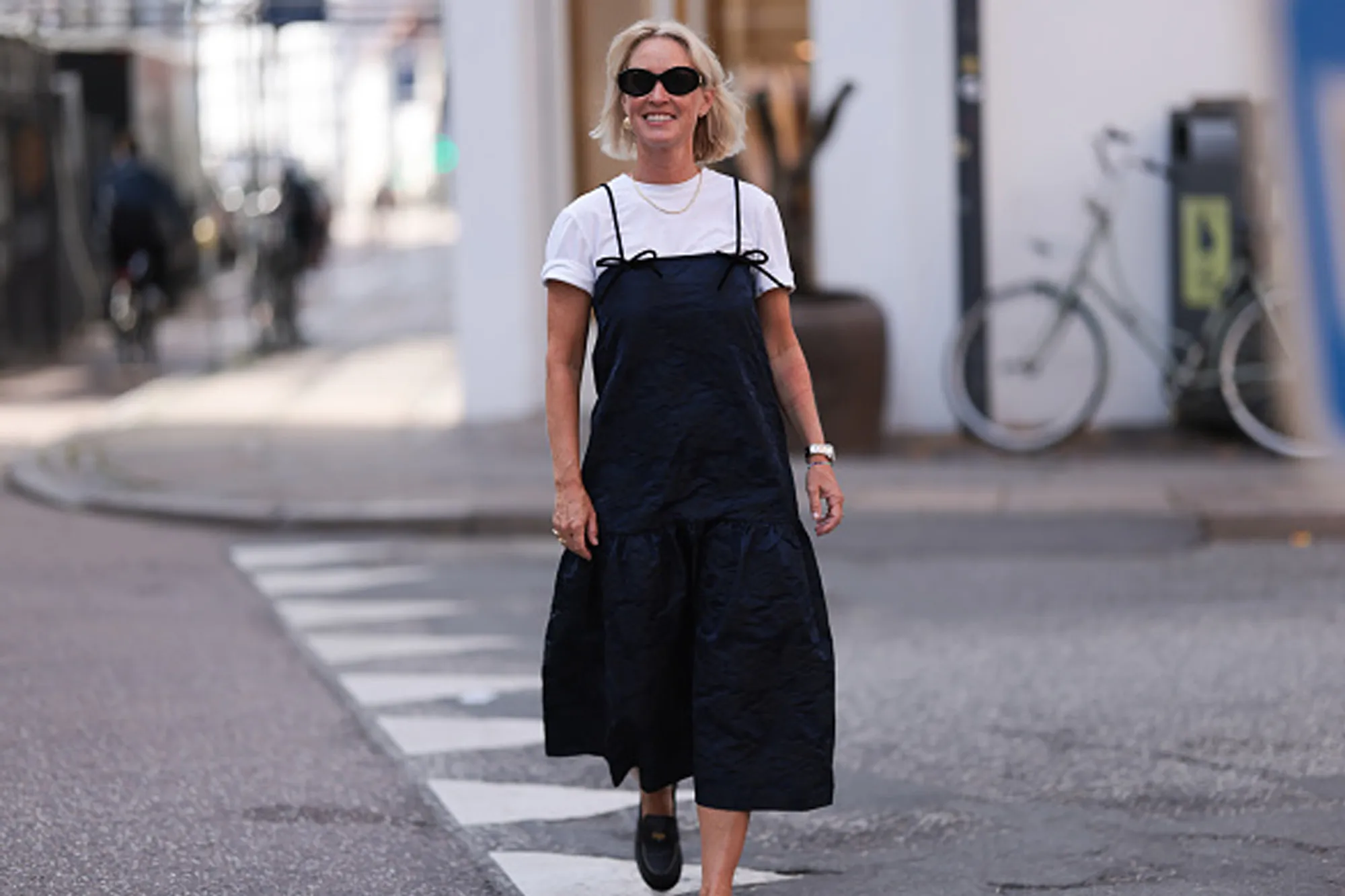 woman wearing cute black midi dress and white tee