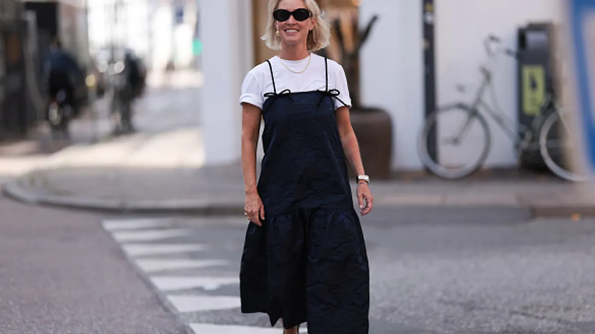 woman wearing cute black midi dress and white tee