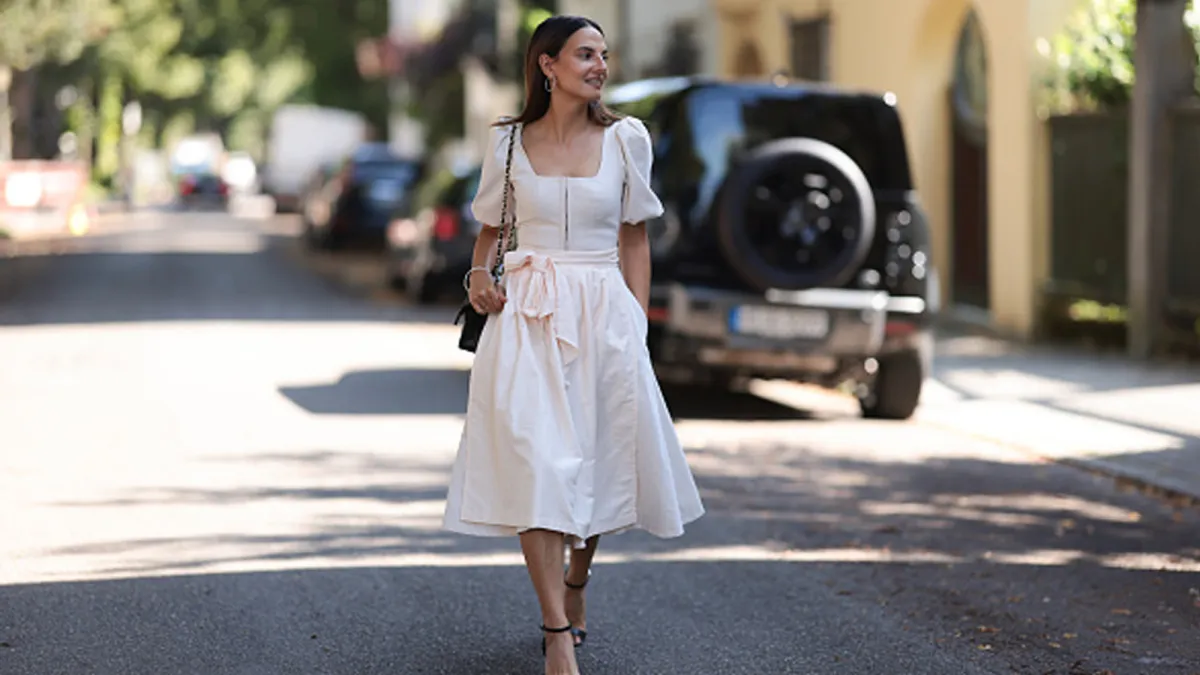 women wearing white puff sleeve dress