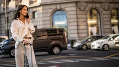 woman wearing white blouse and pants in city