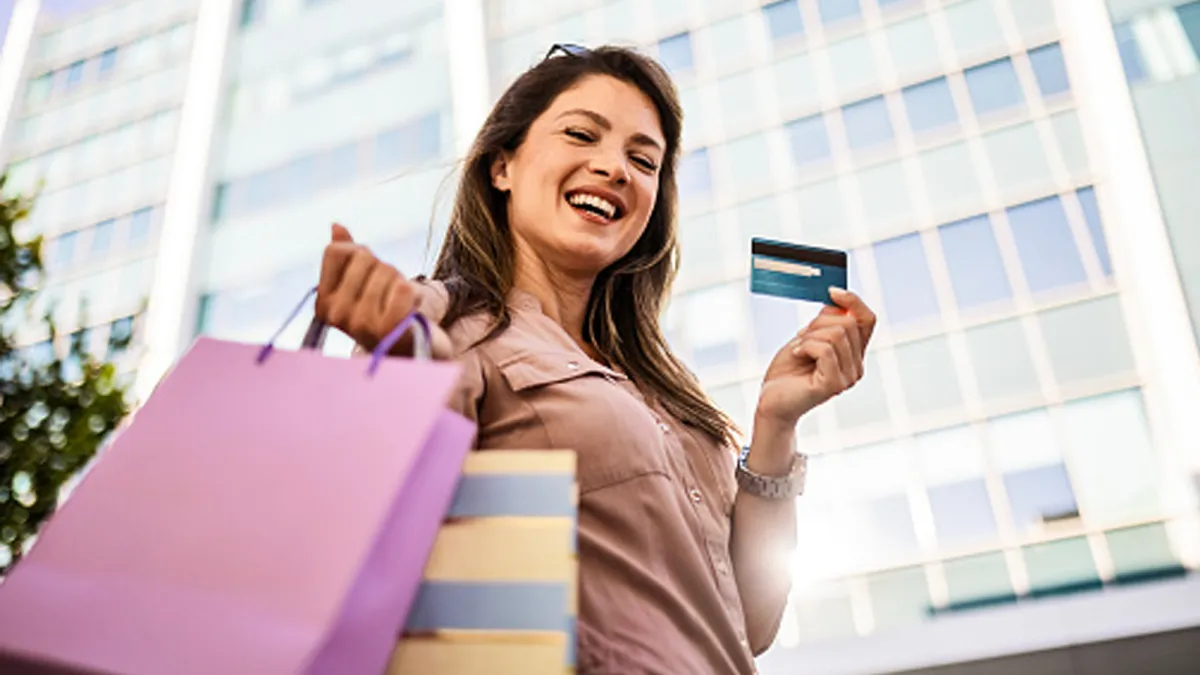 woman with shopping bags and credit card