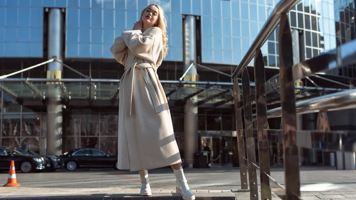 Young blonde woman in autumn city