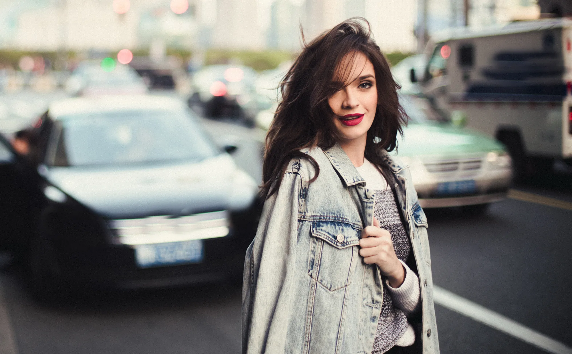 Young beautiful woman standing on the street