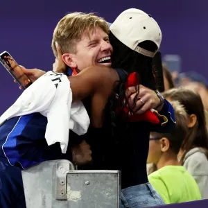 Hunter Woodhall Wins Gold at Paralympics Weeks After Wife Tara Davis Woodhall Wins Olympic Gold