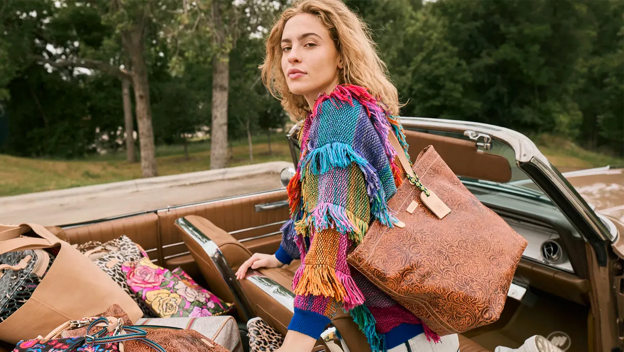 a woman with a bag on her shoulder