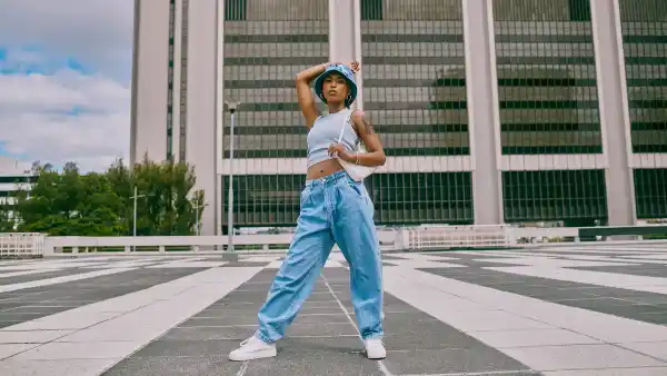 Shot of a trendy young woman posing against a city background