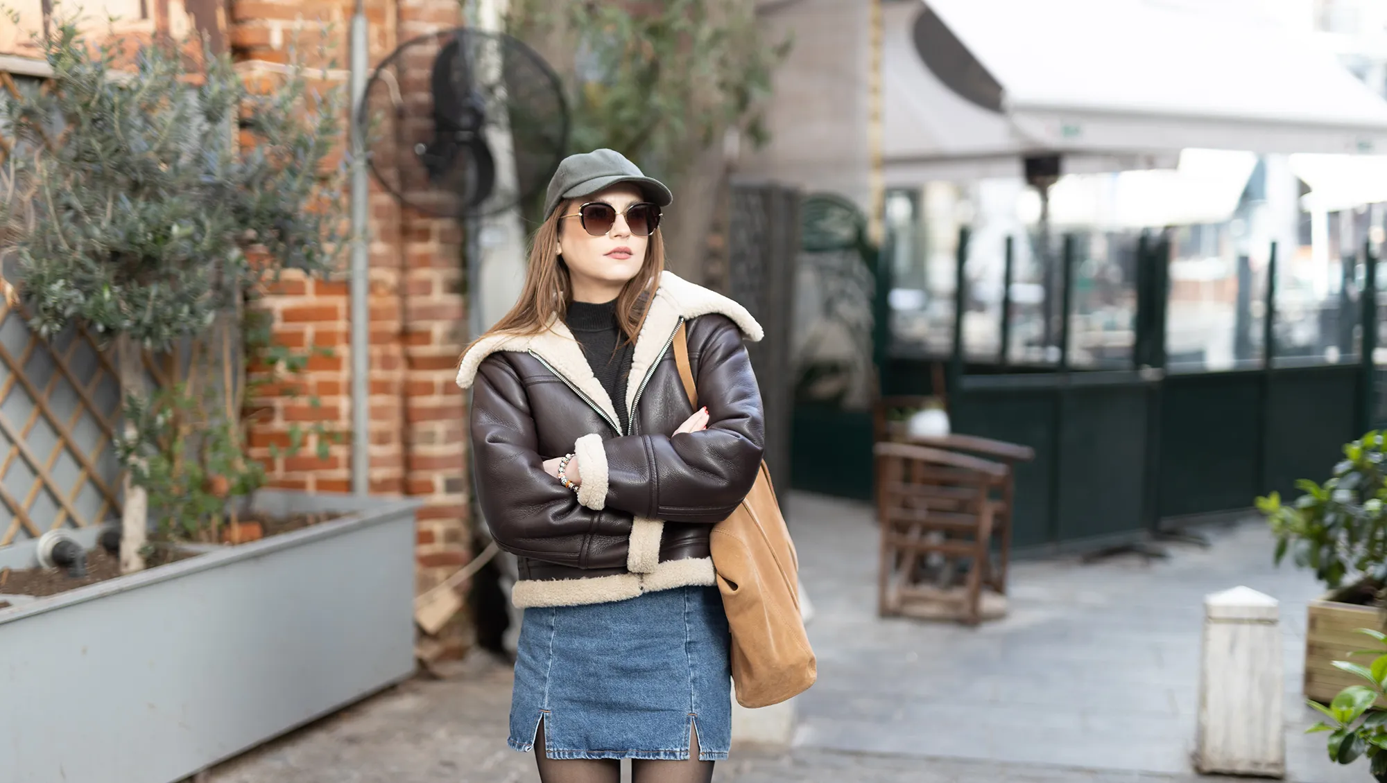 Portrait of a beautiful young fashionable woman wearing a cap.