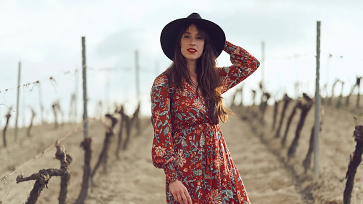 woman wearing floral fall dress