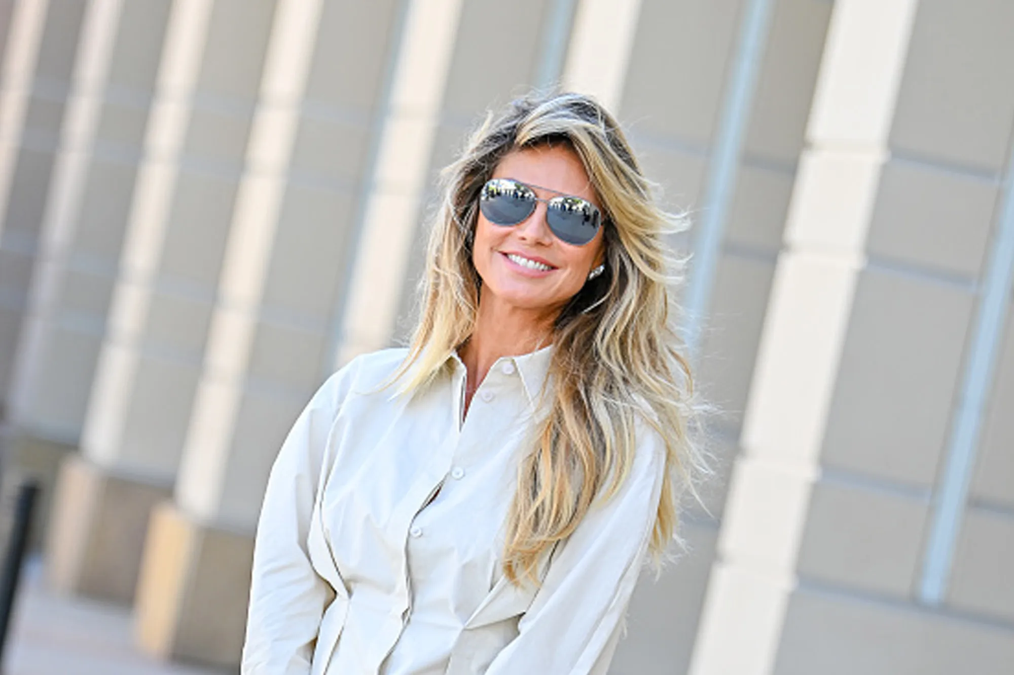 heidi klum in cream set and sunglasses