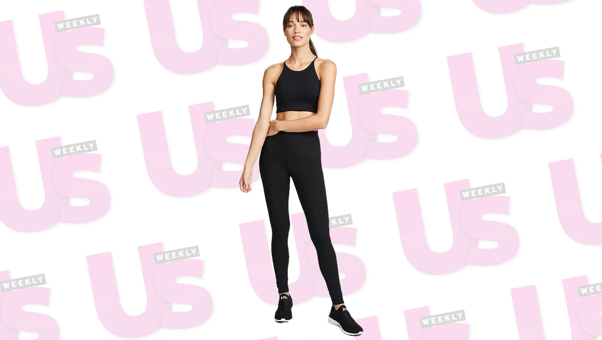 a woman in black leggings in front of a patterned background.