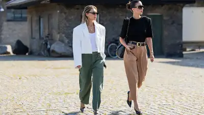 two women wearing green and beige pants