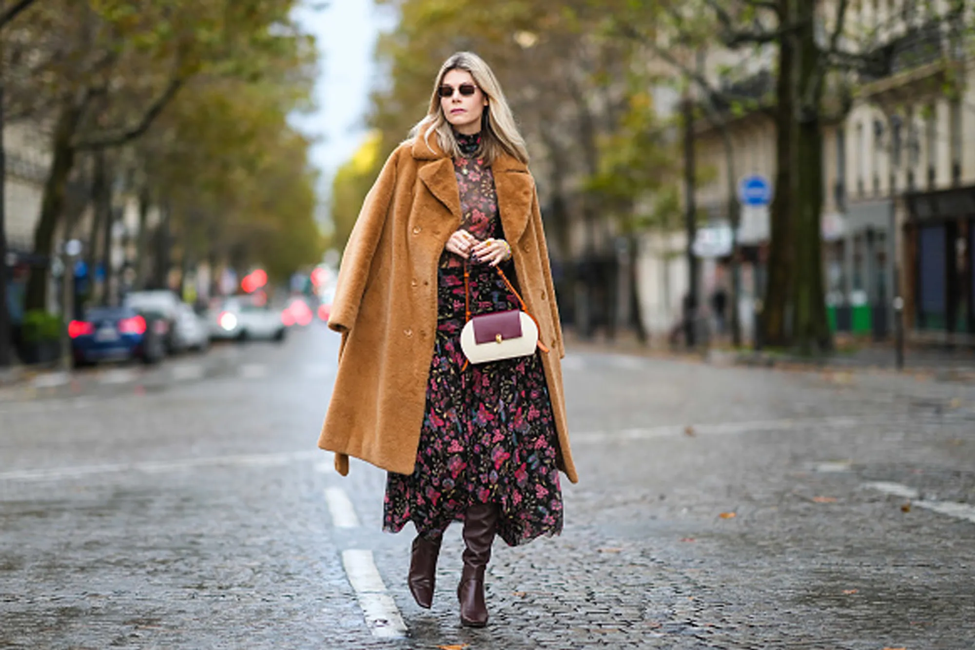 woman wearing floral fall dress and tan coat