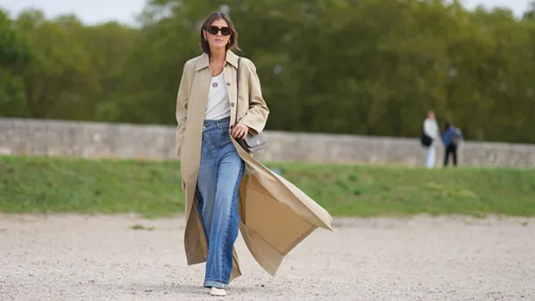 woman wearing trench coat and jeans