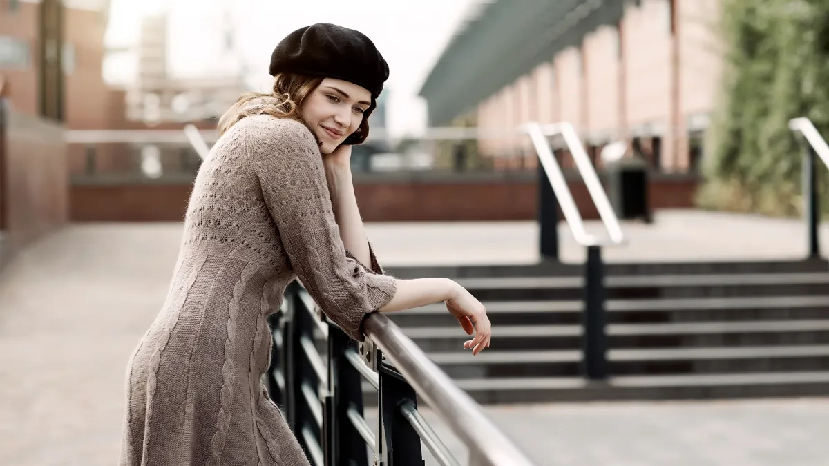 woman wearing a sweater dress in the city