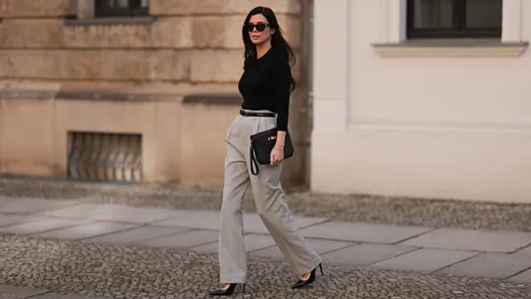 woman wearing beige pants and black top