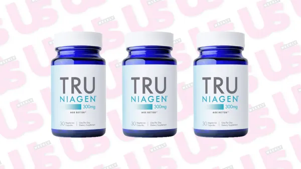 three pill bottles on a patterned background