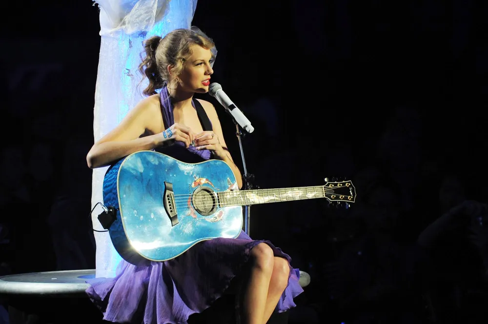 Taylor Swifts New Surprise Song Dress Perfectly Matches Speak Now World Tour Koi Fish Guitar