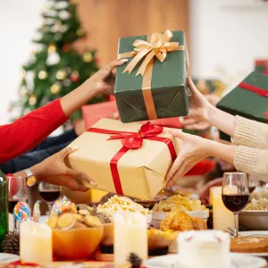 The family is happily exchanging gifts at Christmas.
